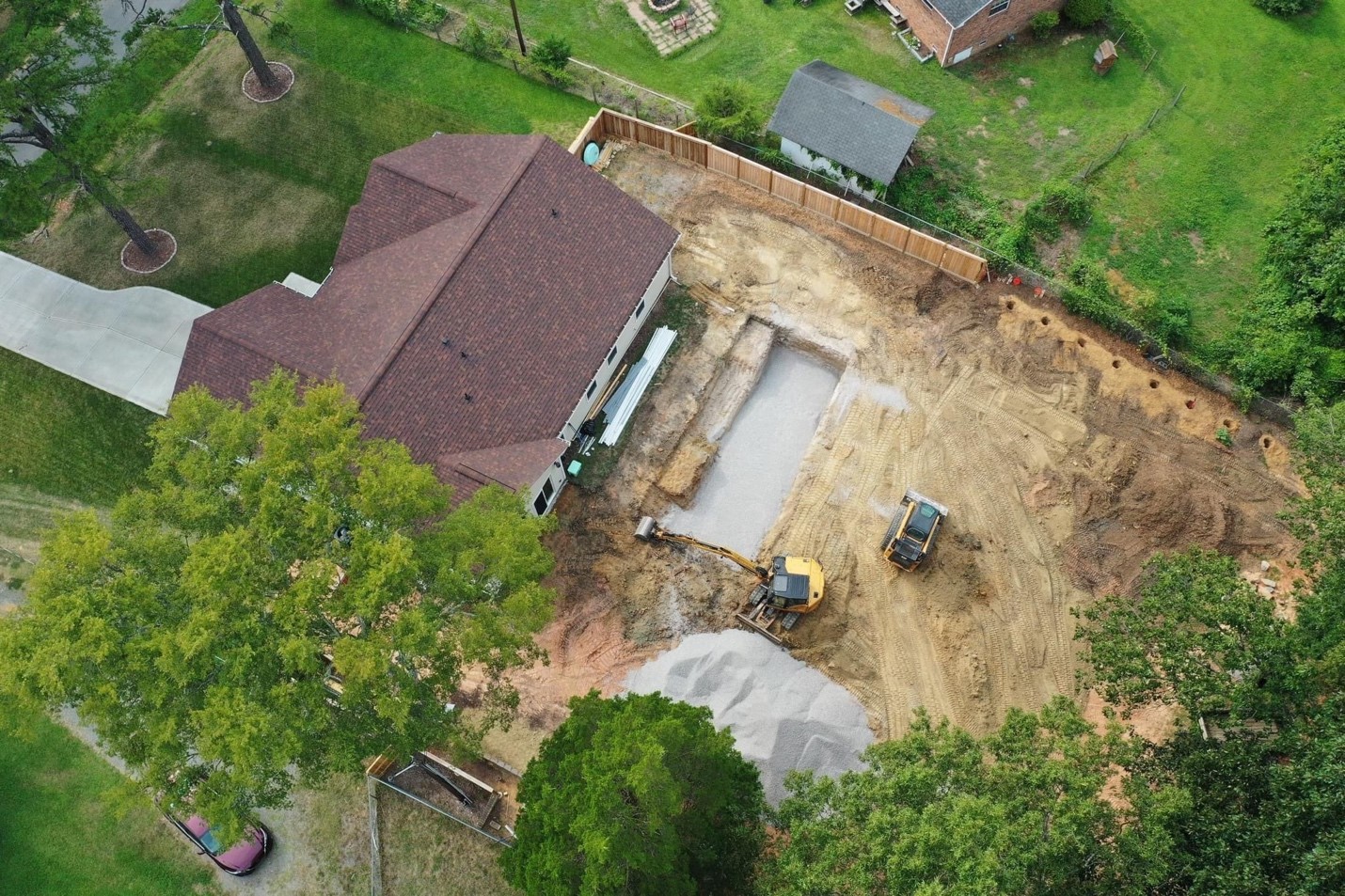 Illustrated crew installing a residential swimming pool